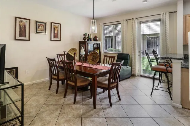 a view of a livingroom with furniture and a window