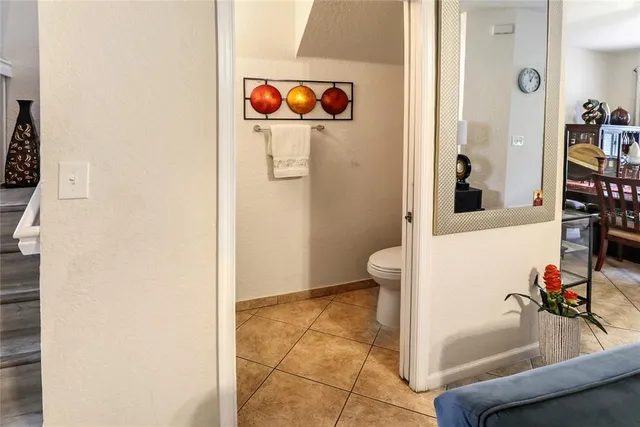 wooden floor with table and chairs