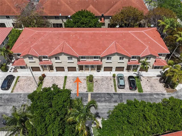 an aerial view of a house with a garden