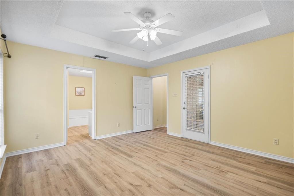 2824 Crestview Avenue Tyler, TX 75701 - Photo 24 of 39 wooden floor in an empty room with a chandelier fan