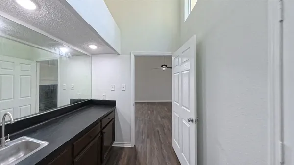 a kitchen with a sink and refrigerator