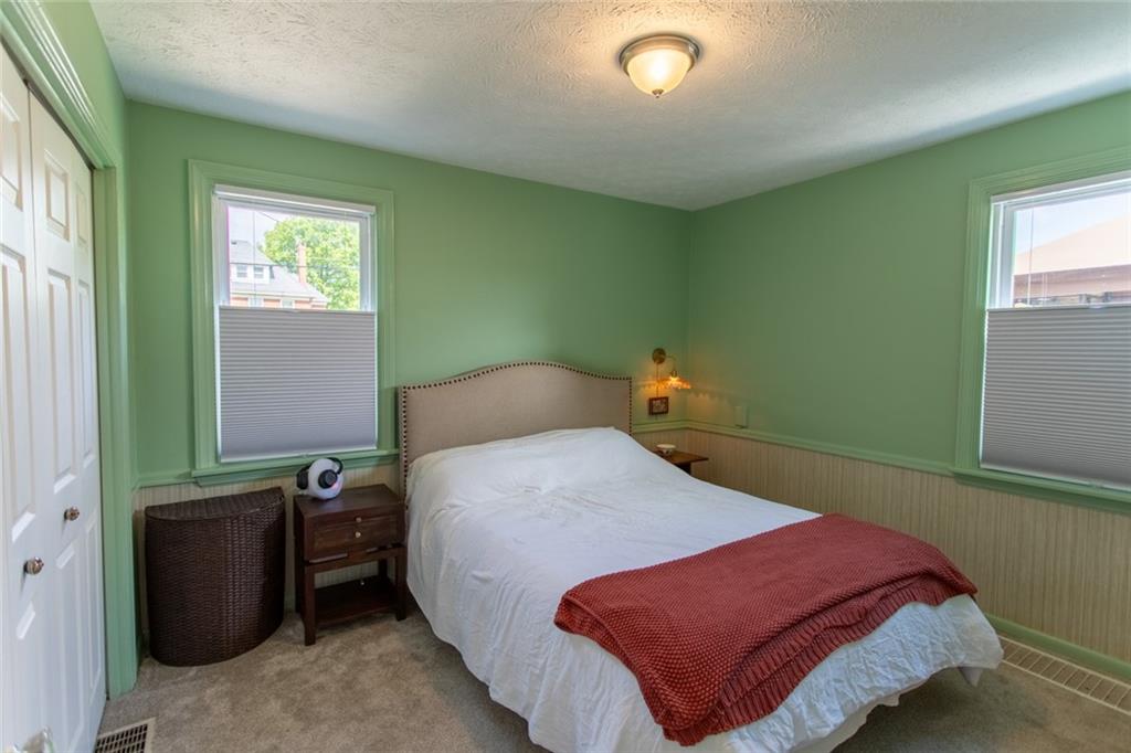 3211 Willett Road Pittsburgh, PA 15227 - Photo 15 of 27 a bedroom with a bed and windows
