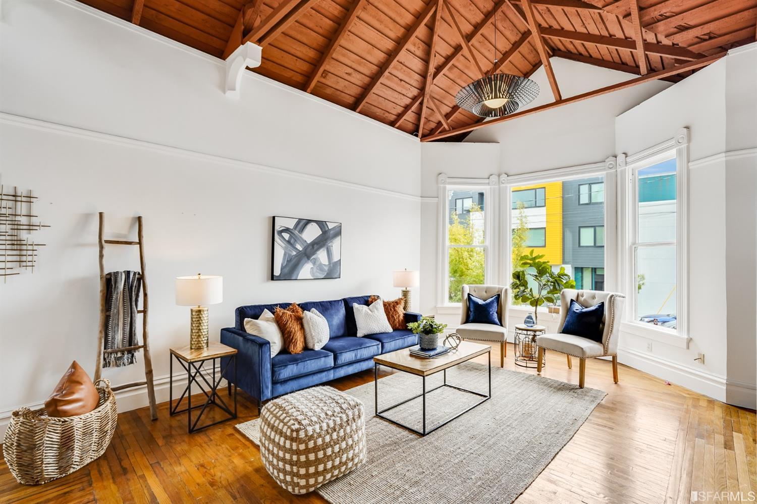 1366 34th Street Oakland, CA 94608 - Photo 12 of 51 a living room with furniture and a large window