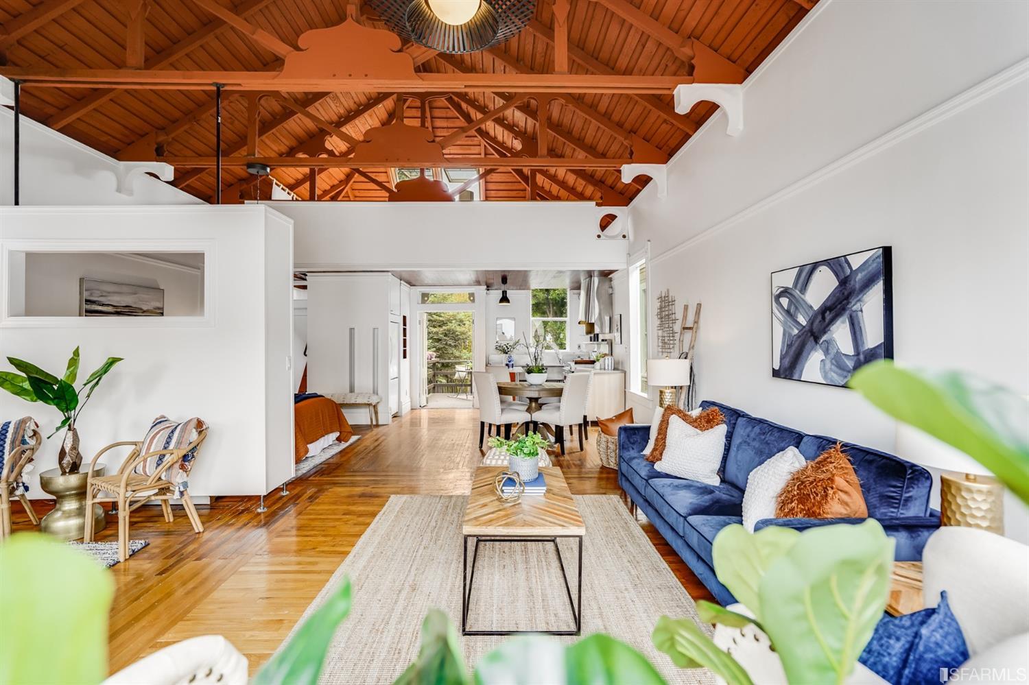 1366 34th Street Oakland, CA 94608 - Photo 14 of 51 a living room with furniture and wooden floor