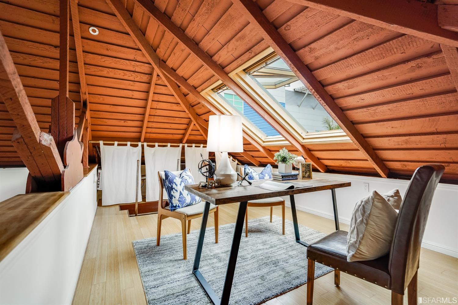1366 34th Street Oakland, CA 94608 - Photo 17 of 51 a balcony with wooden floor and outdoor seating