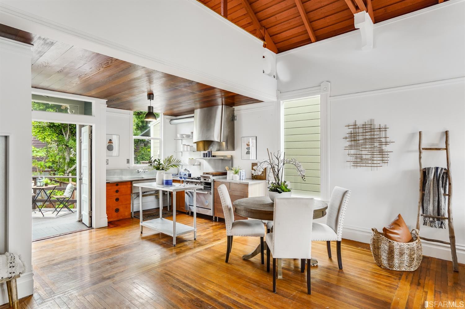 1366 34th Street Oakland, CA 94608 - Photo 21 of 51 a view of a dining room with furniture window and wooden floor