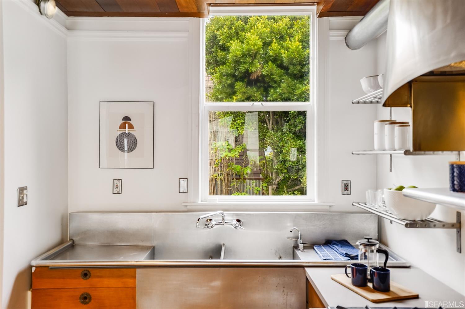 1366 34th Street Oakland, CA 94608 - Photo 23 of 51 a bathroom with a bathtub and a window