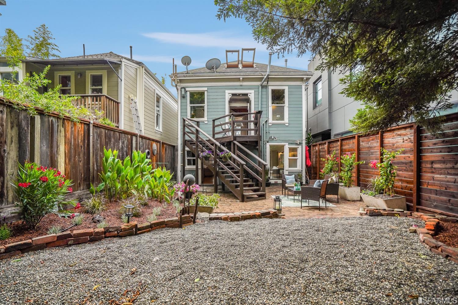 1366 34th Street Oakland, CA 94608 - Photo 31 of 51 a front view of a house with a yard