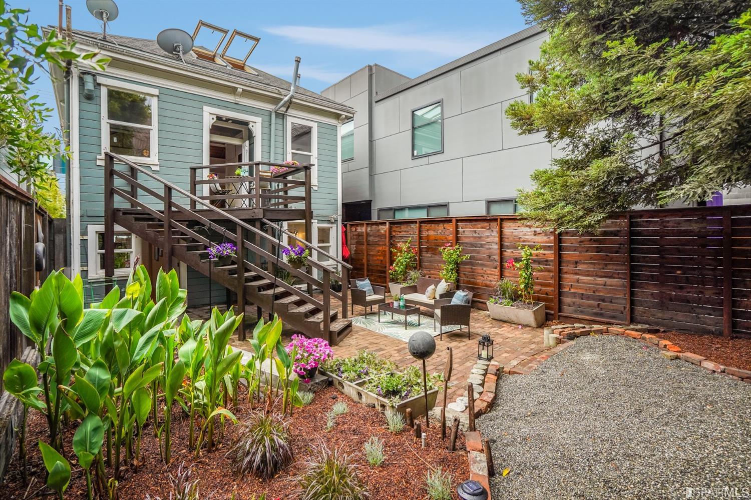 1366 34th Street Oakland, CA 94608 - Photo 32 of 51 a view of a patio with table and chairs and potted plants