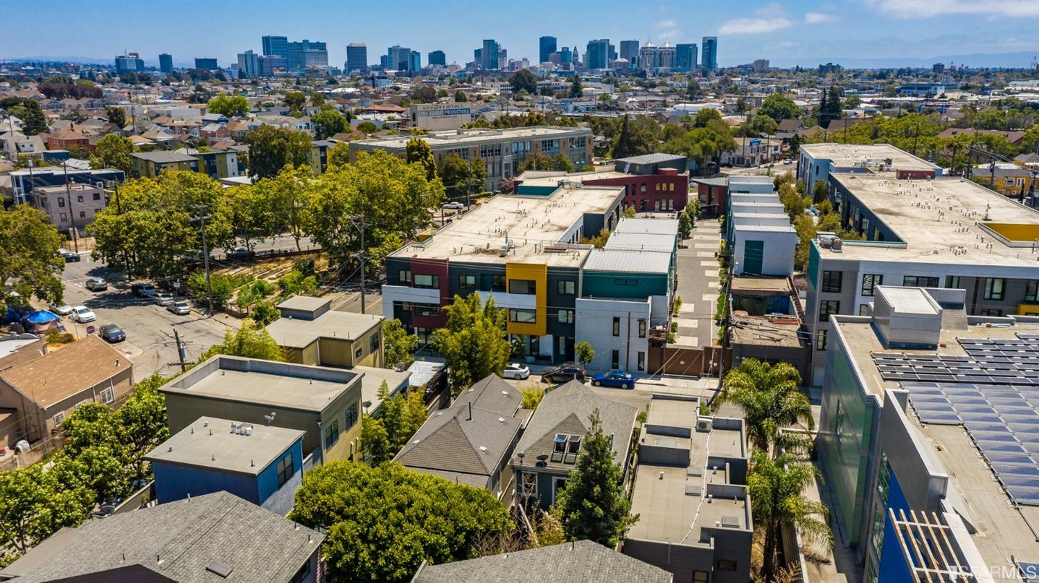1366 34th Street Oakland, CA 94608 - Photo 35 of 51 an aerial view of a residential apartment building with a yard