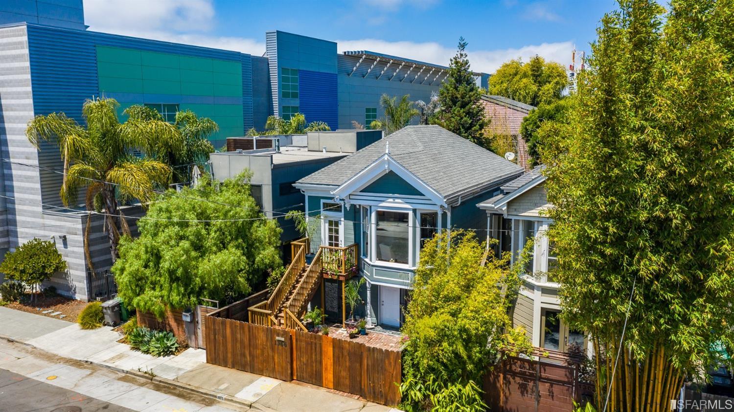 1366 34th Street Oakland, CA 94608 - Photo 36 of 51 a view of a house with brick walls and potted plants