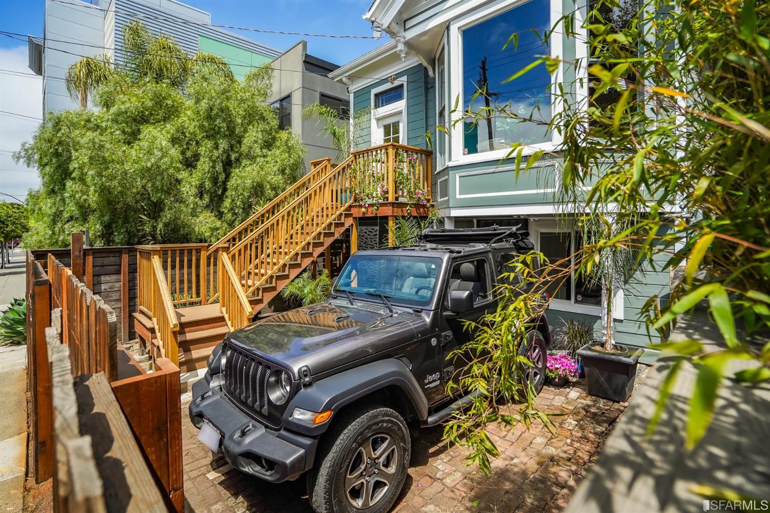 1366 34th Street Oakland, CA 94608 - Photo 39 of 51 a view of an chairs and tables in the back yard