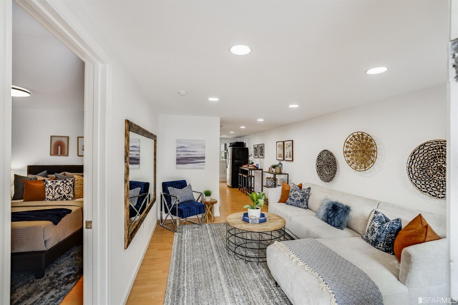 1366 34th Street Oakland, CA 94608 - Photo 40 of 51 a living room with furniture and wooden floor