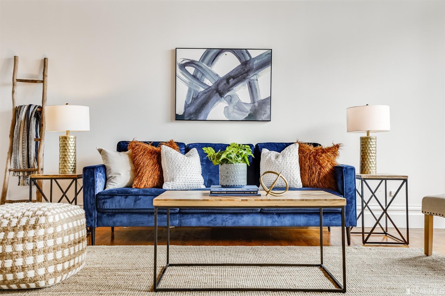 1366 34th Street Oakland, CA 94608 - Photo 4 of 51 a bedroom with a bed and painting on wall