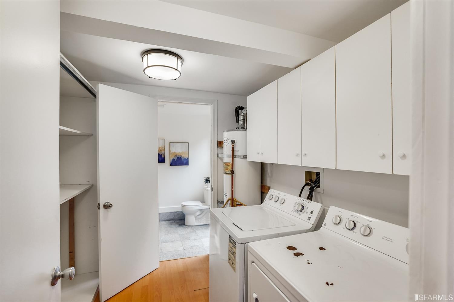1366 34th Street Oakland, CA 94608 - Photo 47 of 51 a view of kitchen and utility room with washer and dryer