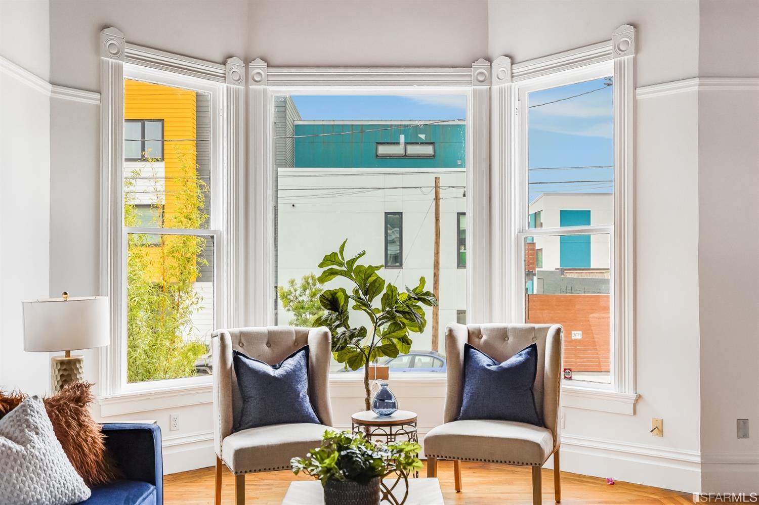 1366 34th Street Oakland, CA 94608 - Photo 6 of 51 a living room with furniture and a potted plant