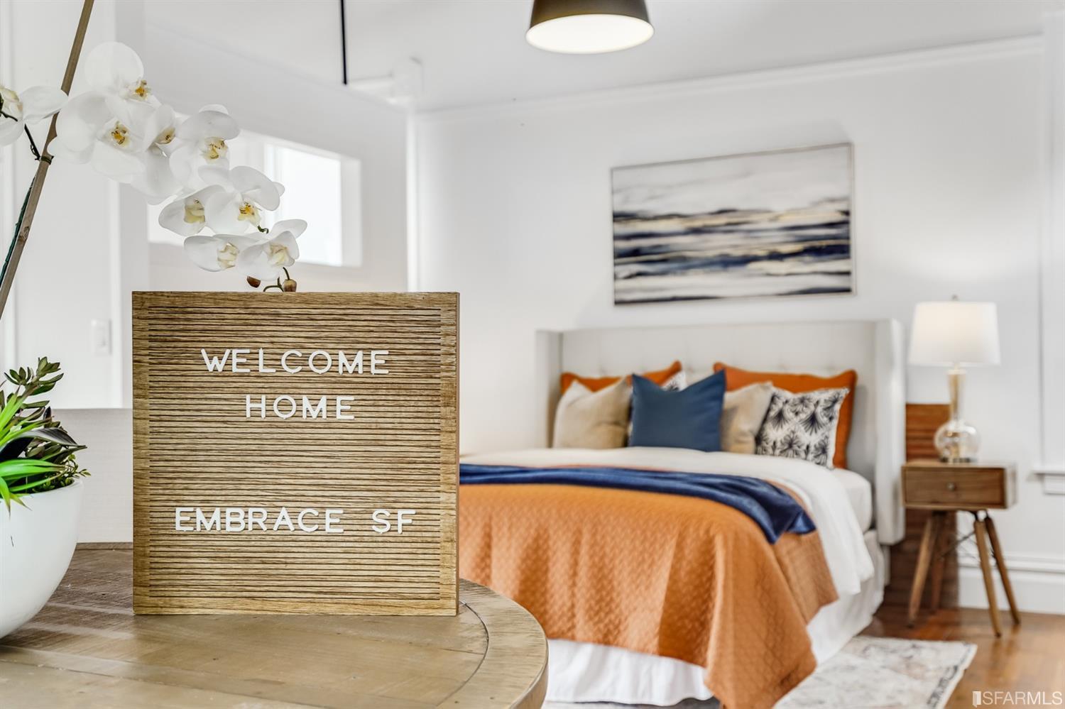 1366 34th Street Oakland, CA 94608 - Photo 9 of 51 a bed sitting in a bedroom next to a window