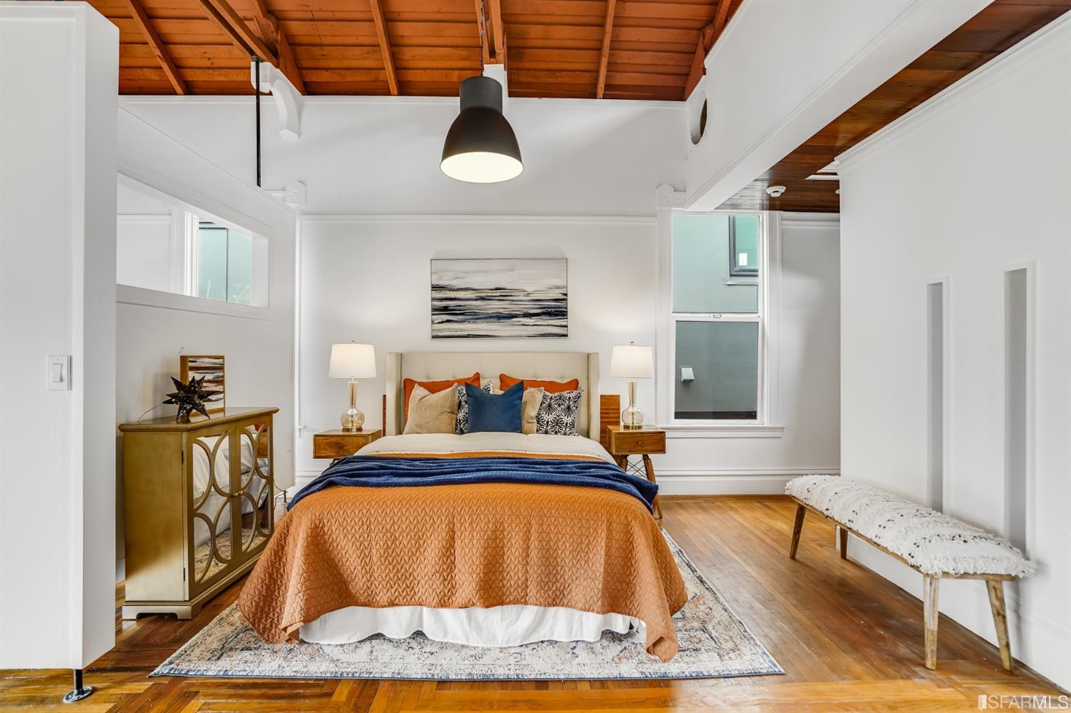 1366 34th Street Oakland, CA 94608 - Photo 10 of 51 a bed sitting in a bedroom next to a window