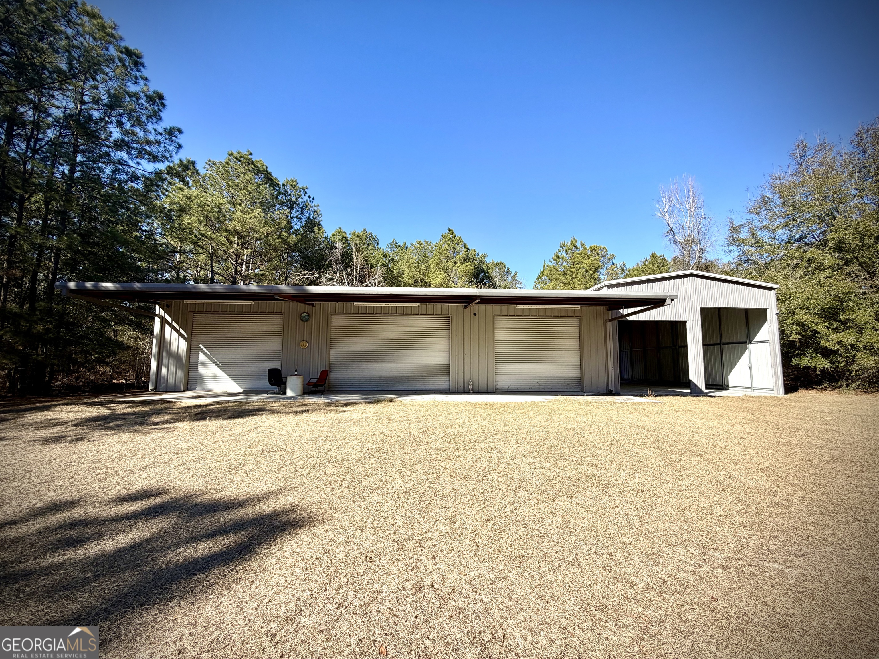 114 Ohoopee Road Adrian, GA 31002 - Photo 7 of 17 front view of a house with a yard