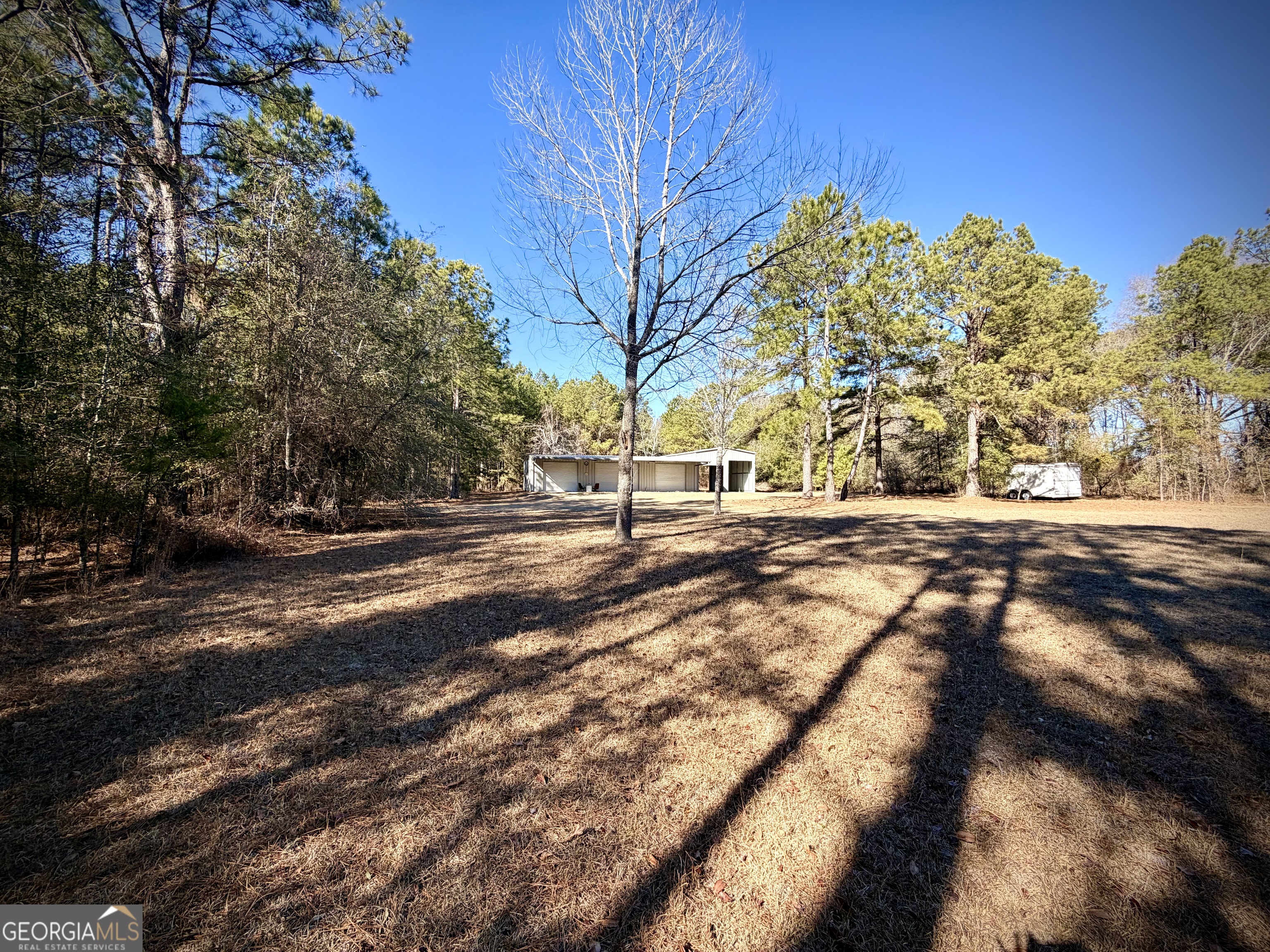 114 Ohoopee Road Adrian, GA 31002 - Photo 10 of 17 a view of road with large trees