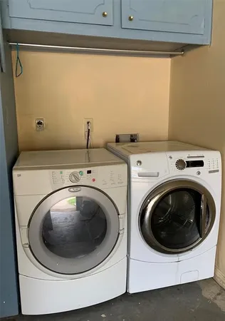 a kitchen with stainless steel appliances kitchen island granite countertop a stove a sink and a microwave