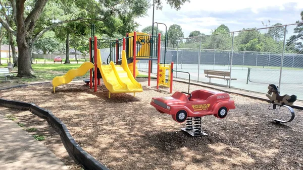 a view of a backyard with swimming pool