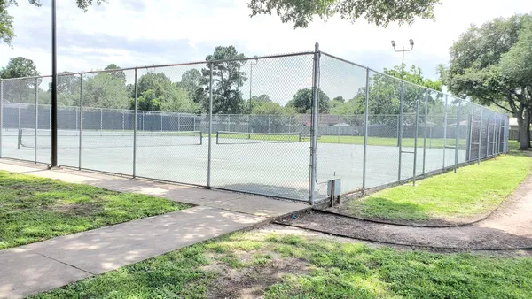 a view of a park with large trees