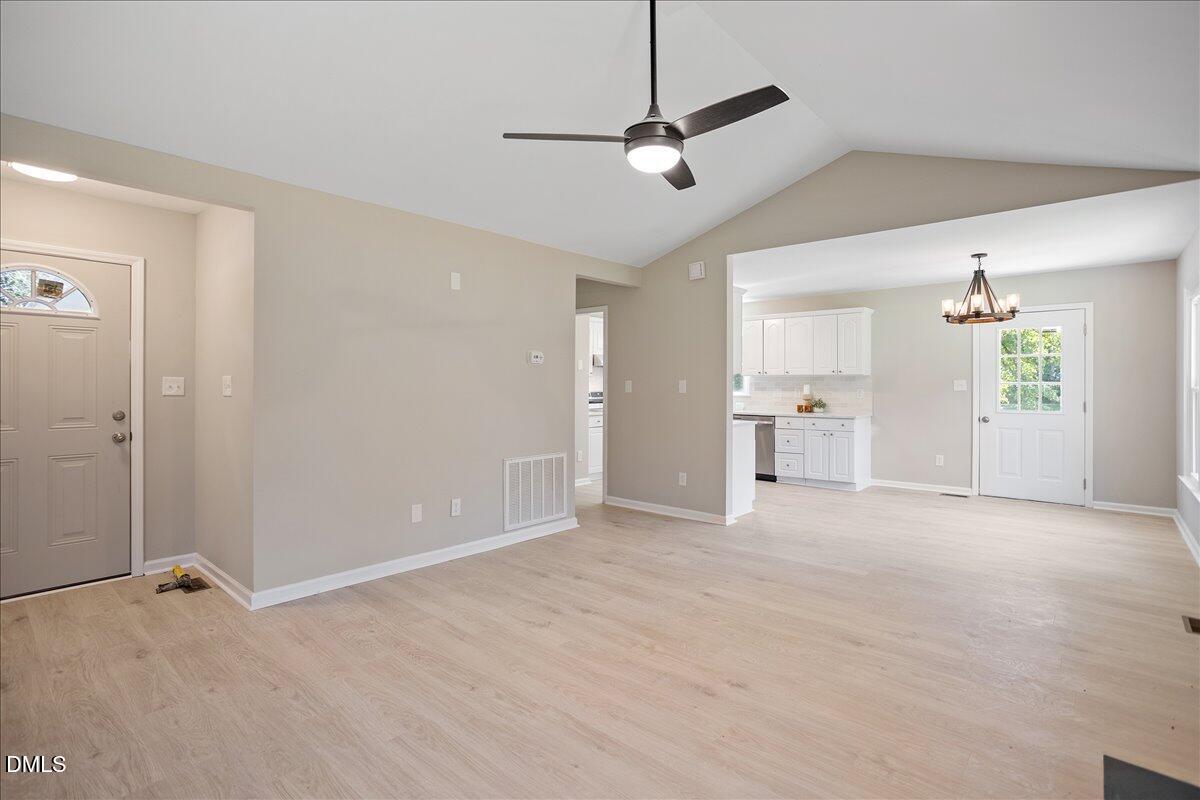31 Fieldview Court Angier, NC 27501 - Photo 5 of 25 a view of a kitchen with a sink and a refrigerator wooden floor
