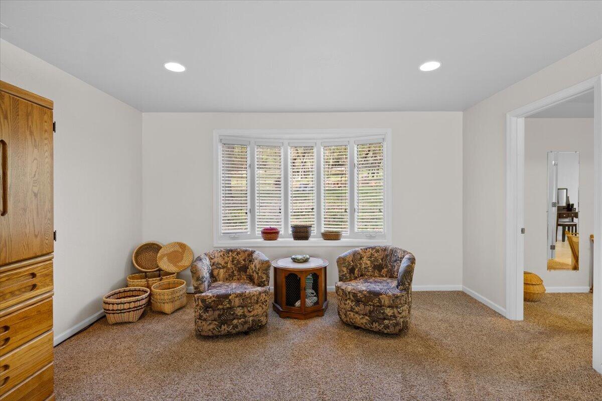 324 China Gulch Road Jacksonville, OR 97530 - Photo 20 of 45 a room with a bed and a couch
