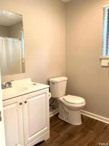 a white toilet sitting next to a bathroom sink