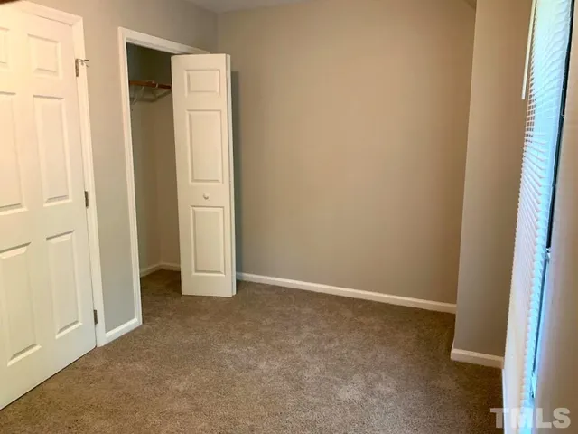 a view of balcony with wooden floor