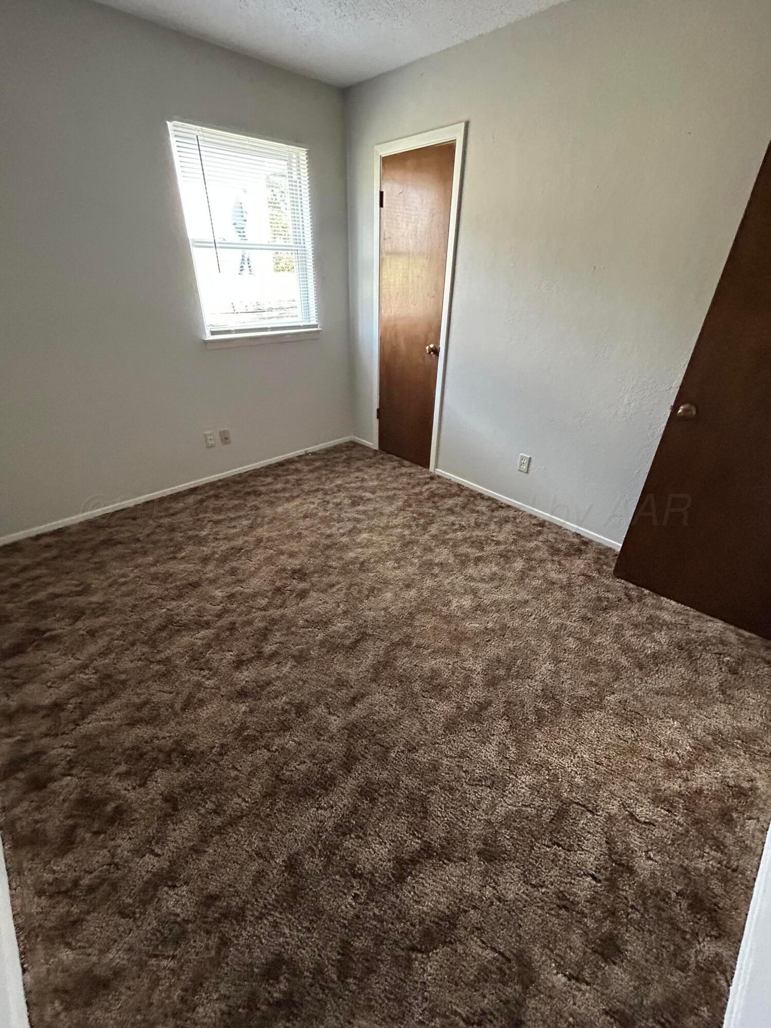 401 Mesa View Miami, TX 79059 - Photo 8 of 11 a view of empty room with window
