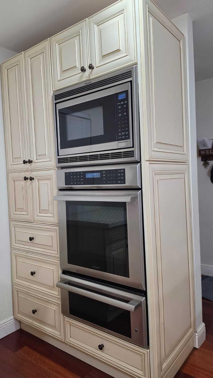 100 Ashbury Road, Unit 206 Hollywood, FL 33024 - Photo 9 of 23 a kitchen with granite countertop white cabinets and stainless steel appliances