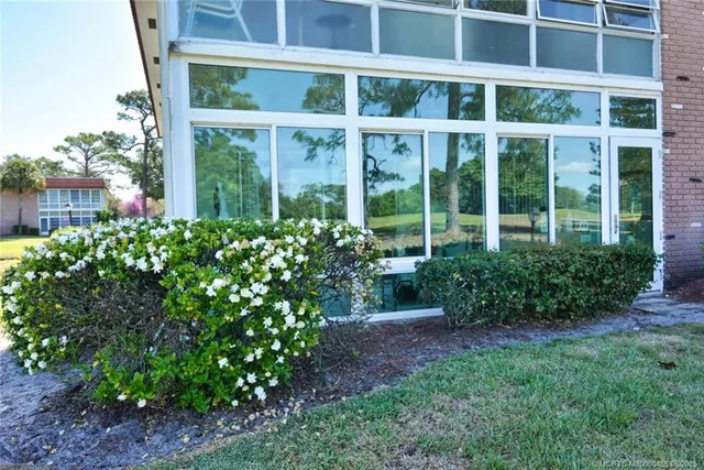 a room with lots of furniture and a large window