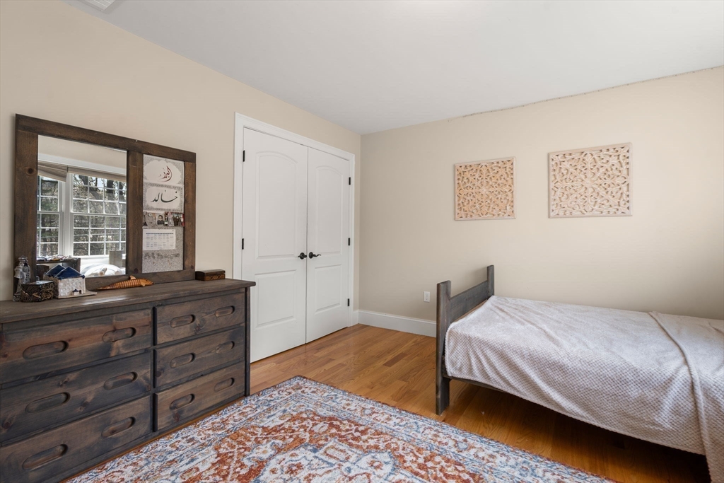 50 Sterling Road Needham, MA 02492 - Photo 17 of 29 a bedroom with a bed and a dresser