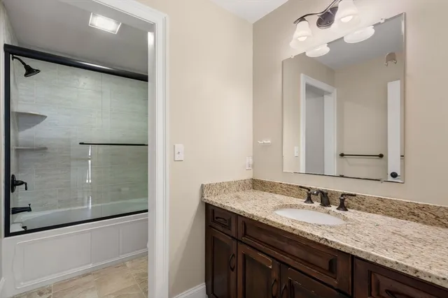 a view of a house with a big yard and large trees