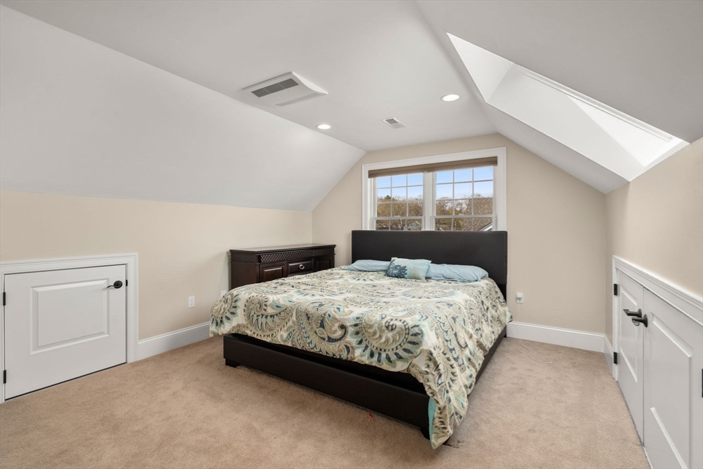 50 Sterling Road Needham, MA 02492 - Photo 19 of 29 a bed sitting in a bedroom next to a window