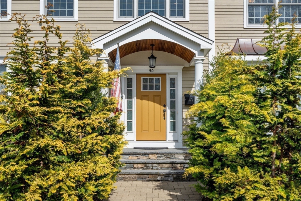 50 Sterling Road Needham, MA 02492 - Photo 2 of 29 a front view of a house with a yard