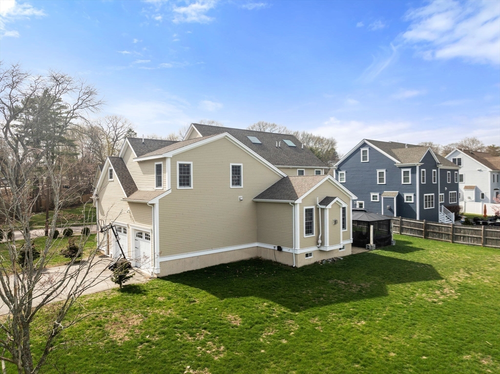 50 Sterling Road Needham, MA 02492 - Photo 25 of 29 a front view of a house with a yard