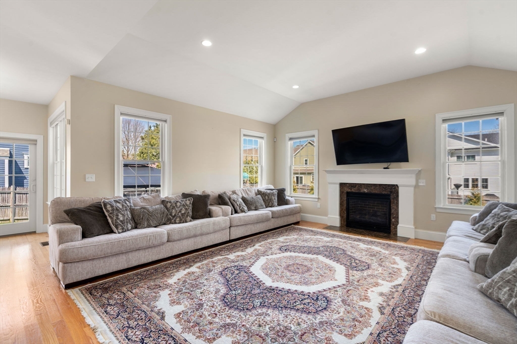 50 Sterling Road Needham, MA 02492 - Photo 7 of 29 a living room with furniture a rug and a fireplace