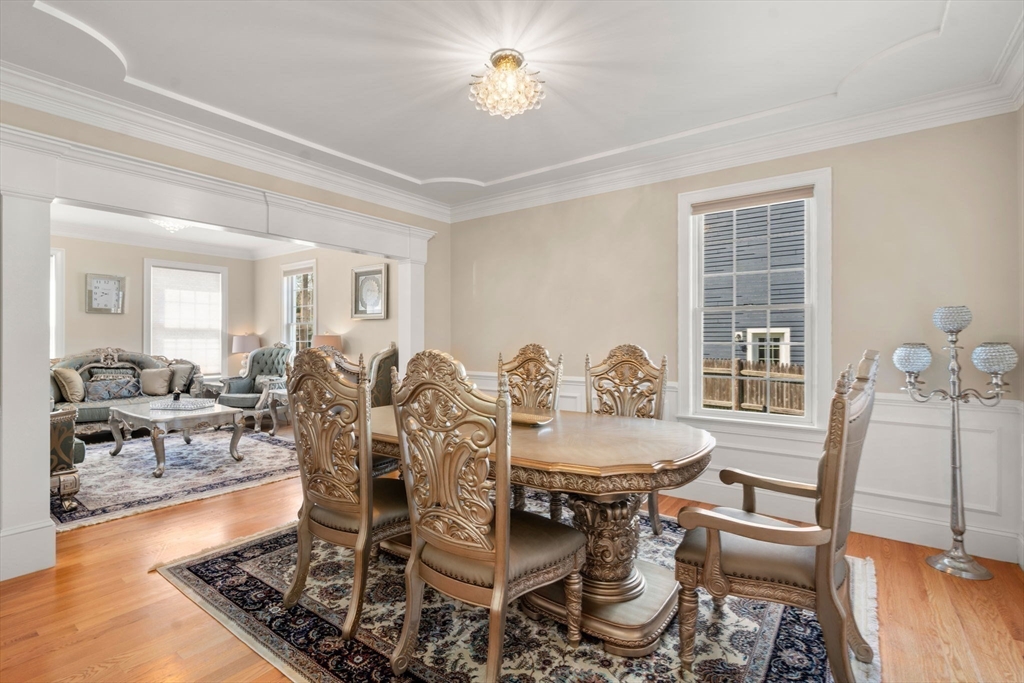 50 Sterling Road Needham, MA 02492 - Photo 9 of 29 a view of a dining room with furniture and wooden floor