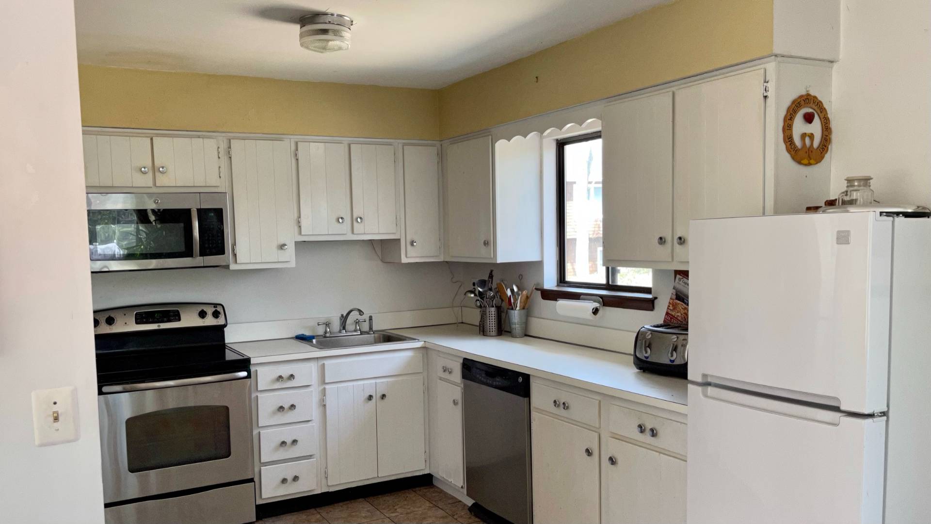 11 Bathgate Road Wainscott, NY 11975 - Photo 3 of 13 a kitchen with appliances a sink and cabinets