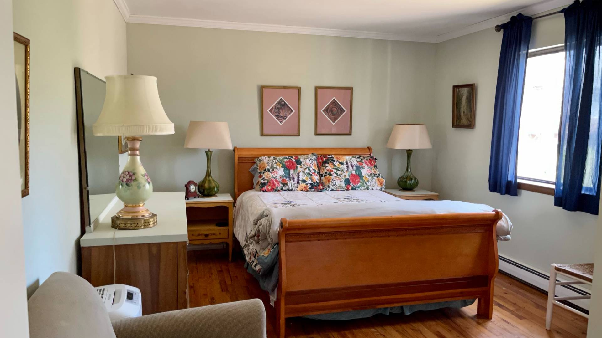 11 Bathgate Road Wainscott, NY 11975 - Photo 6 of 13 a bedroom with a bed and wooden floor