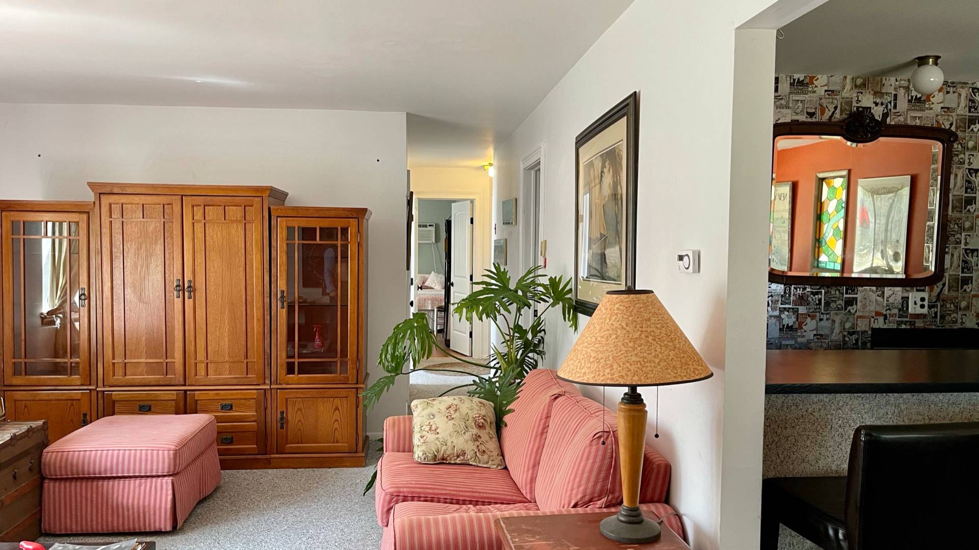 11 Bathgate Road Wainscott, NY 11975 - Photo 9 of 13 a living room with furniture and a lamp