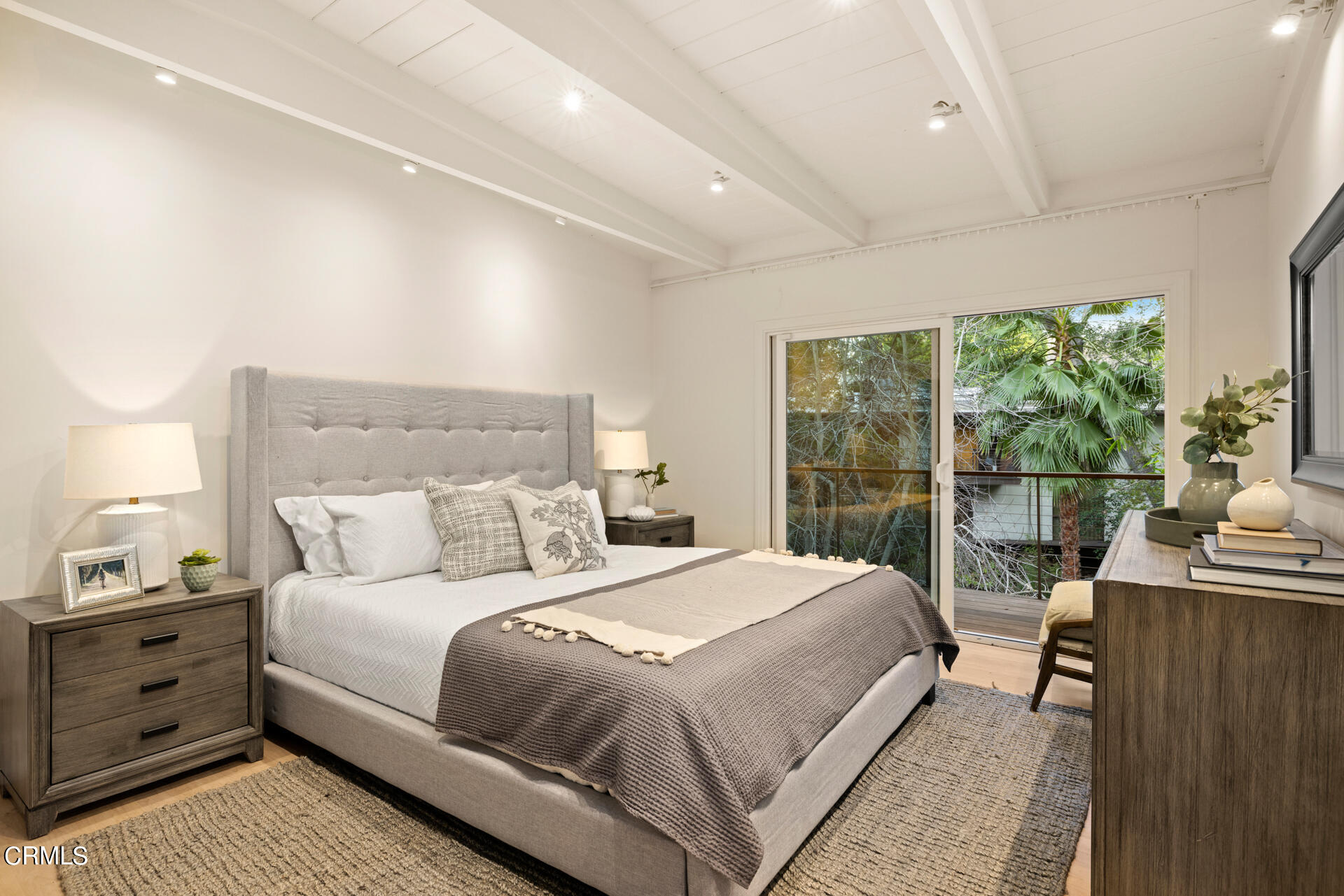 911 Laguna Road Pasadena, CA 91105 - Photo 17 of 34 a bedroom with a bed and large windows