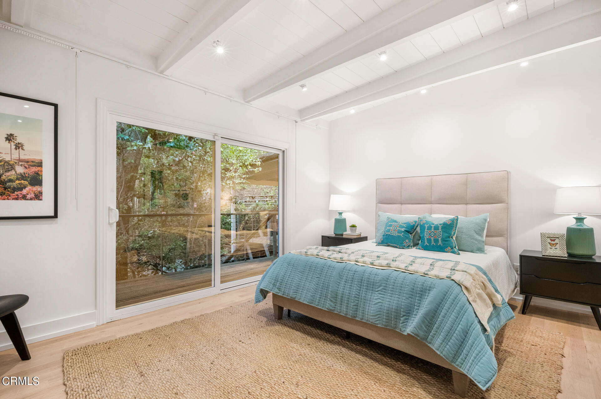 911 Laguna Road Pasadena, CA 91105 - Photo 19 of 34 a bedroom with a bed lamp and window