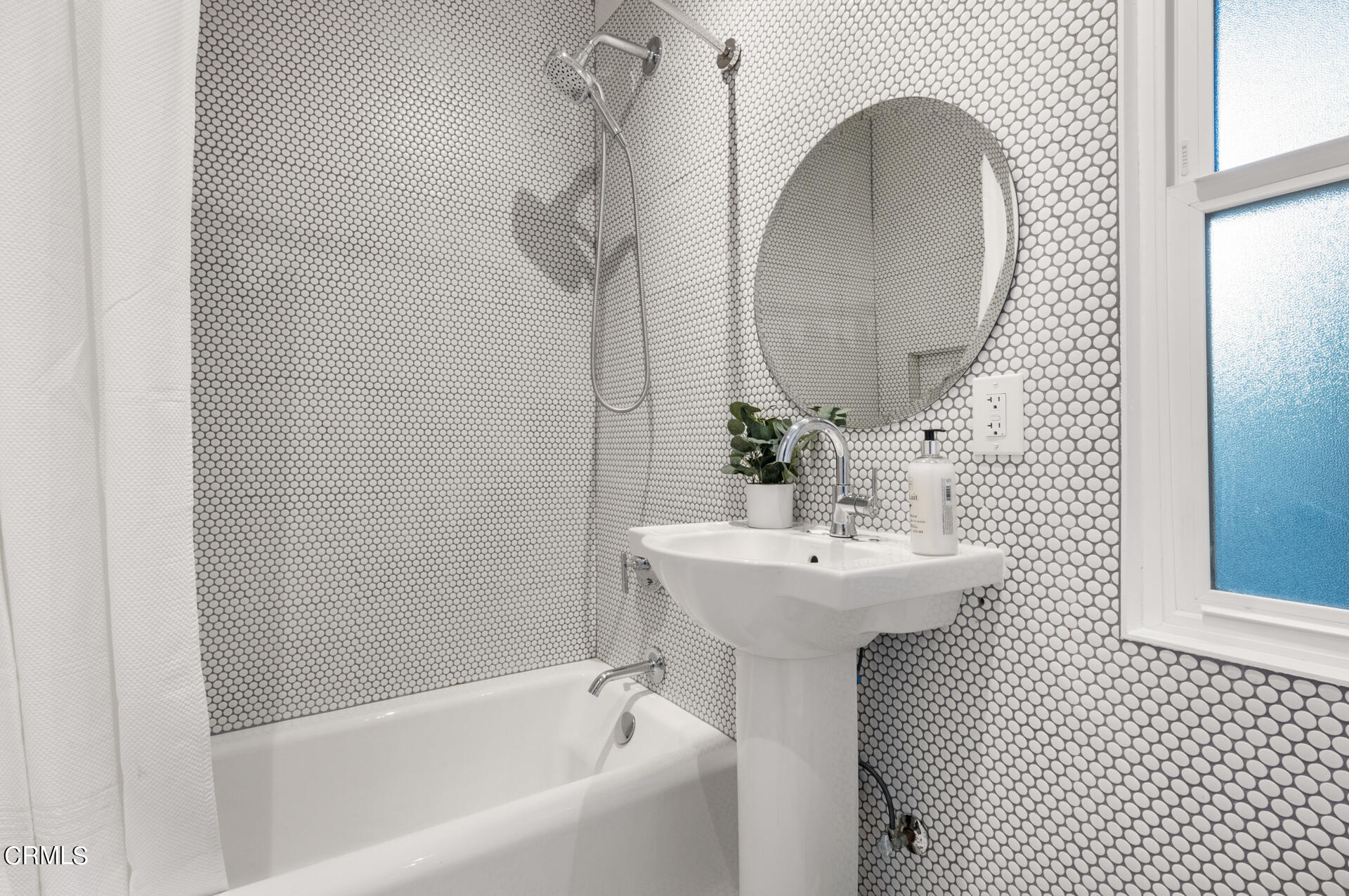 911 Laguna Road Pasadena, CA 91105 - Photo 20 of 34 a bathroom with a sink a mirror and bathtub