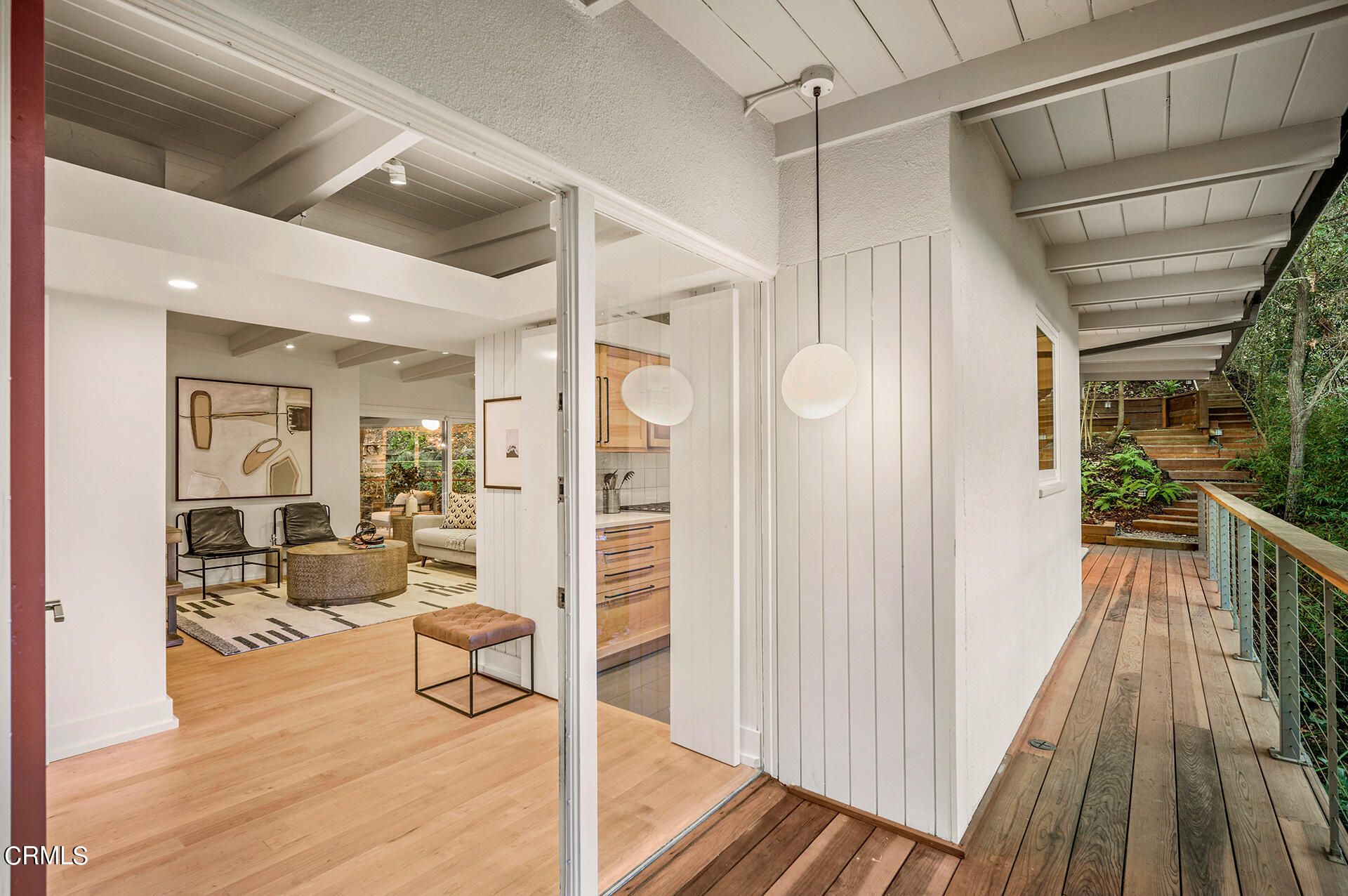 911 Laguna Road Pasadena, CA 91105 - Photo 2 of 34 a view of a hallway with wooden floor and furniture