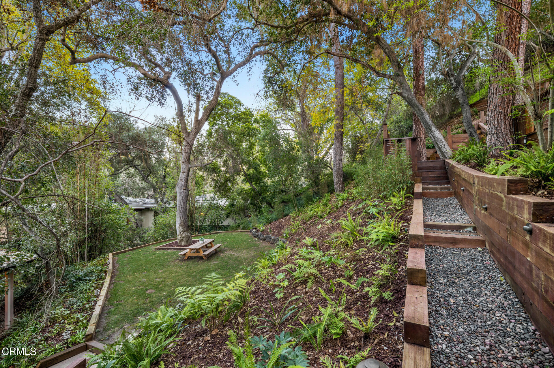911 Laguna Road Pasadena, CA 91105 - Photo 29 of 34 a backyard of a house with lots of green space