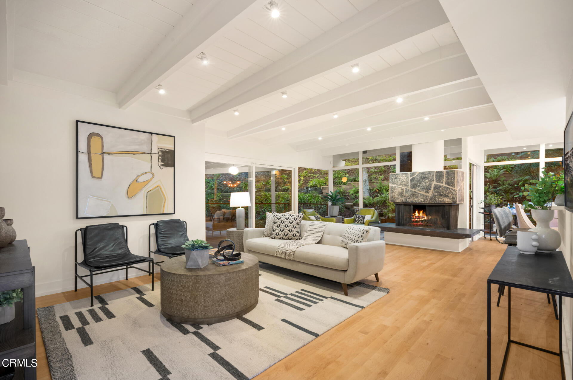 911 Laguna Road Pasadena, CA 91105 - Photo 3 of 34 a living room with furniture and a fireplace